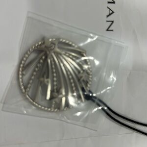 David Yurman necklace. Silver with black chord, shooting star necklace.